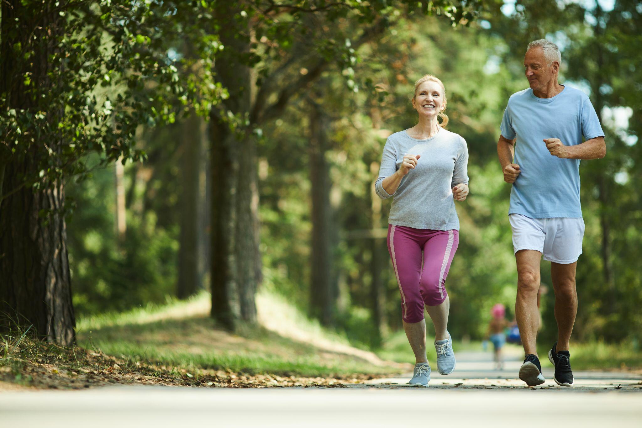 Seniors Jogging through a Park